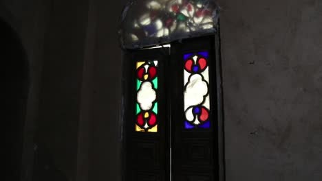 intriguing stained glass doors and windows in an old building
