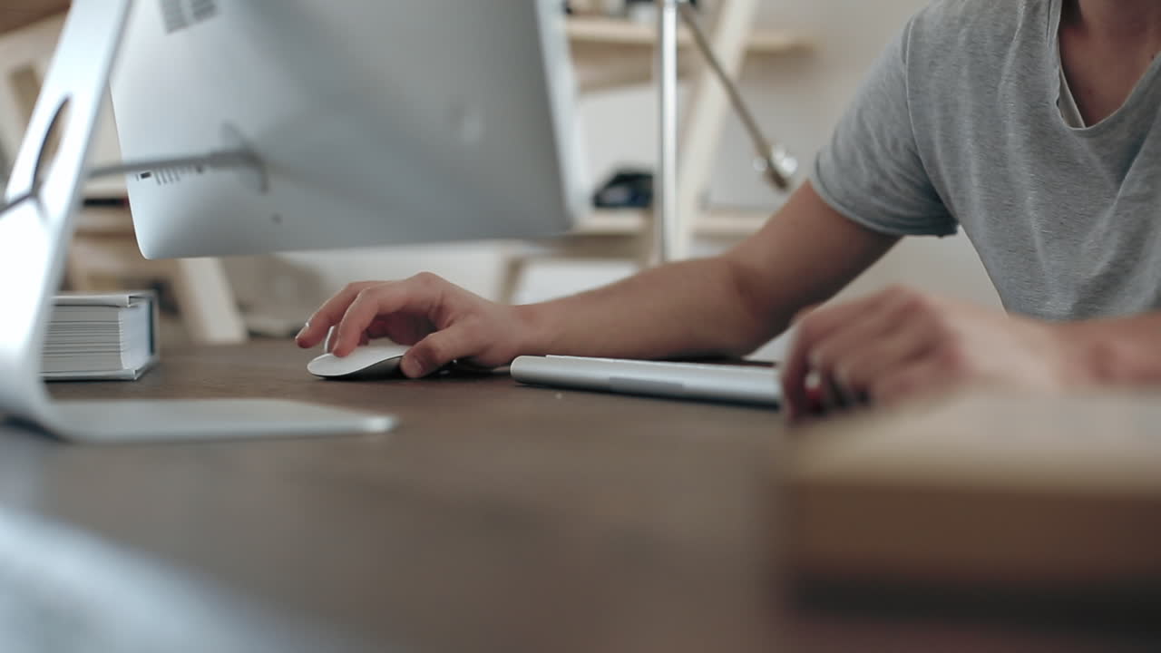 Person working on computer at home office
