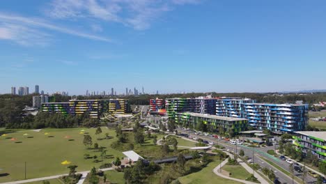 public park near the colorful building structures at southport, queensland in australia under clear blue sky