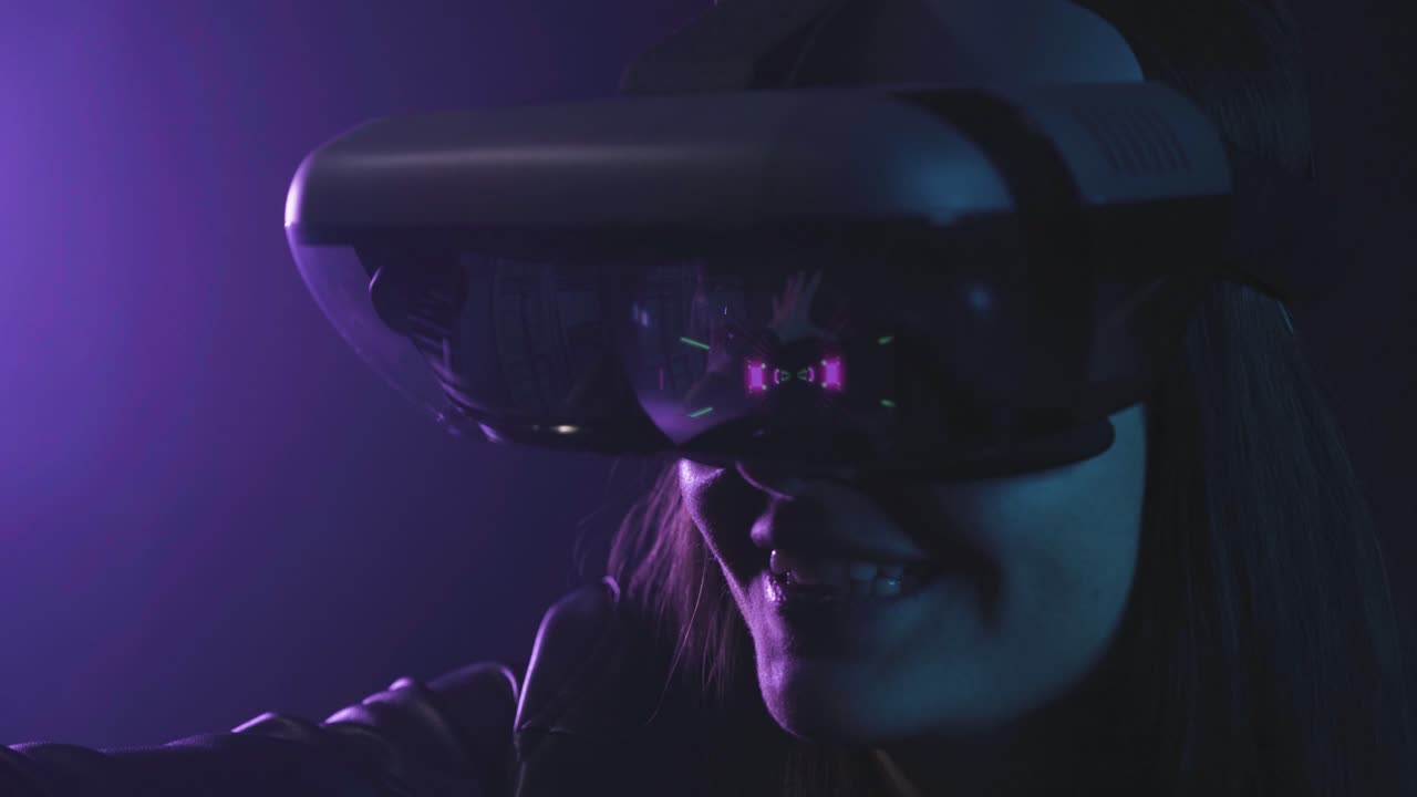 Anonymous woman in VR goggles in neon light
