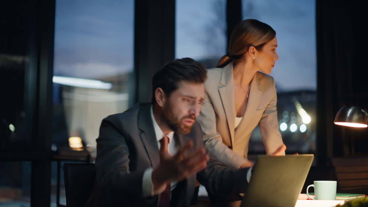 Late coworkers looking computer screen office closeup. Colleagues reacting fail