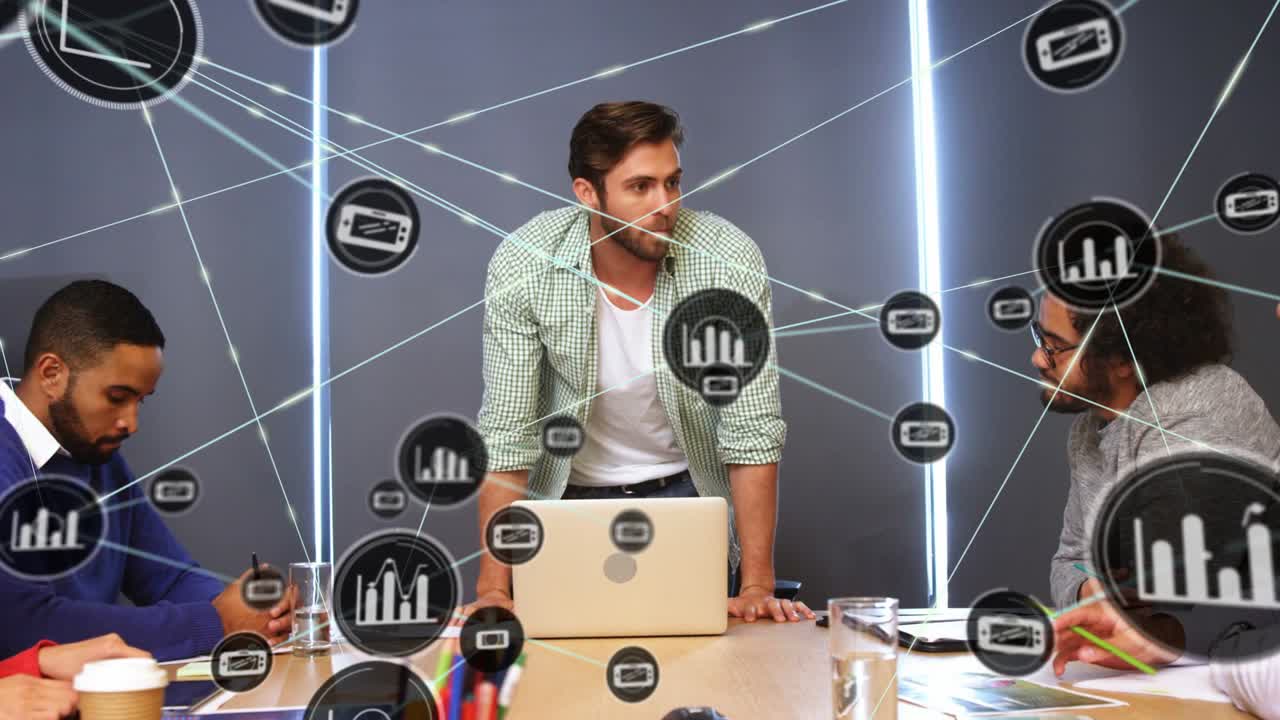 Male presenter leaning forward, focusing on laptop, causing business data icons forming web overlay