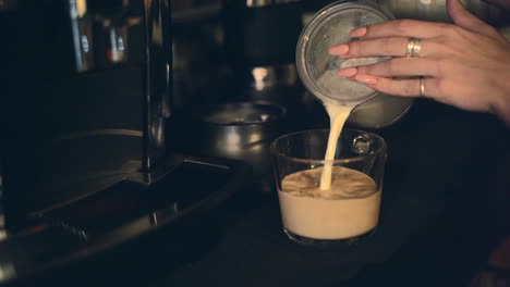 preparing a latte with coffee machine