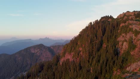 Sunset-Slow-Rising-Aerial-Drone-with-Mountain-Trees-and-Landscape-with-Blue-Sky-Background-Pacific-Ranges-Canada-BC-4K