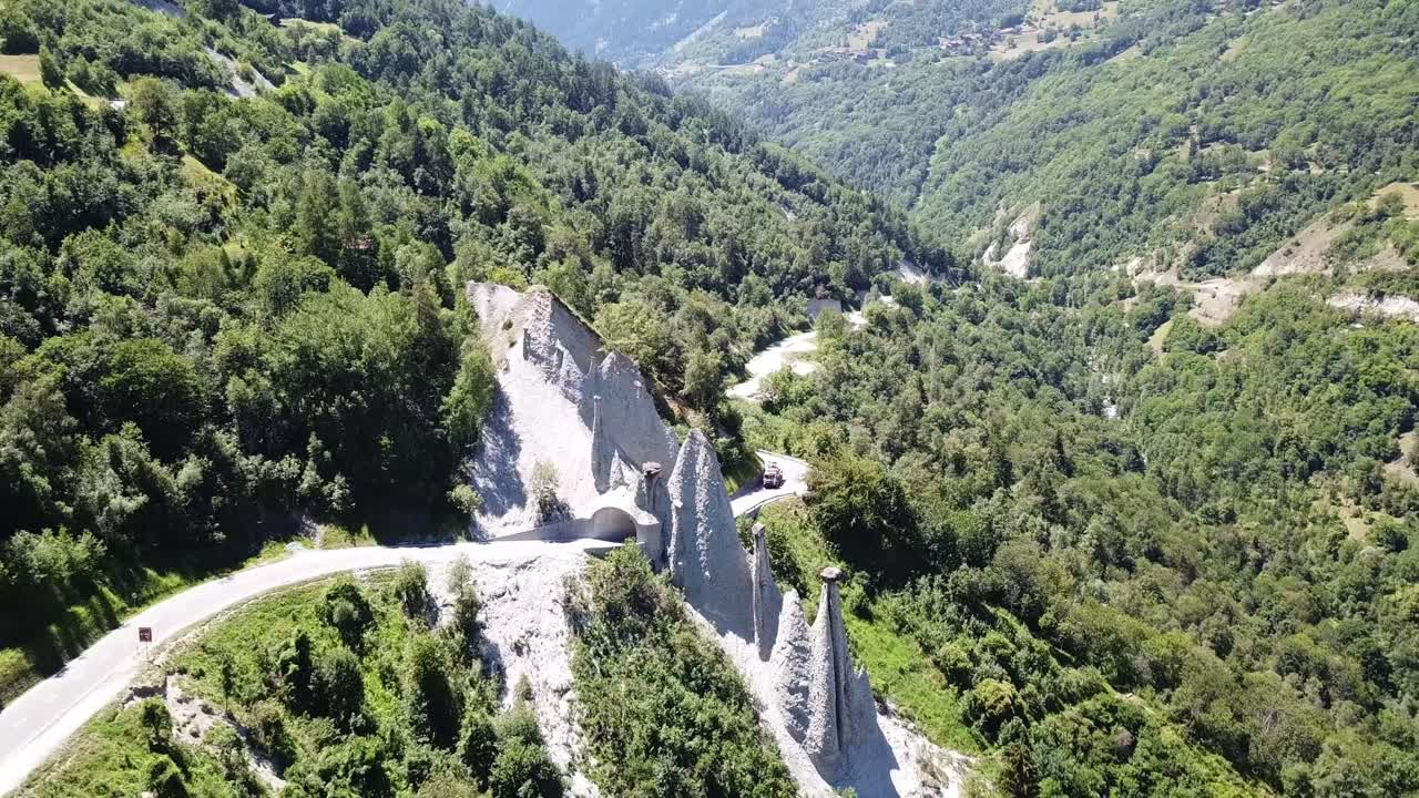 Aerial View of Winding Mountain Road and Earth Pyramids in Italy