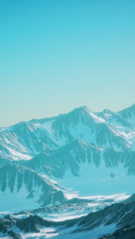 snow-capped mountains against a blue sky