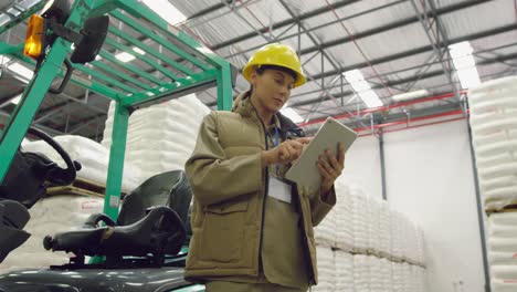 portrait of young female worker in a warehouse