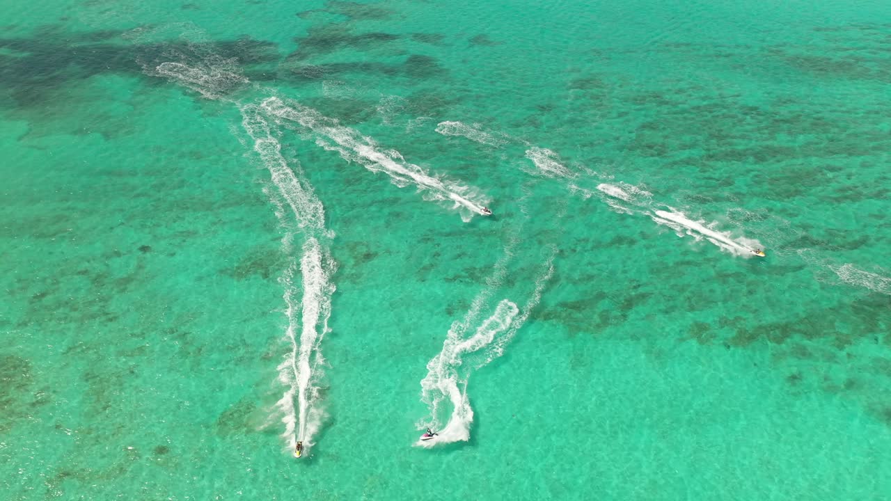 Aerial View of Group of Jet Skies in Turquoise Sea. Luxury Vacation Activity in Nassau, Bahamas