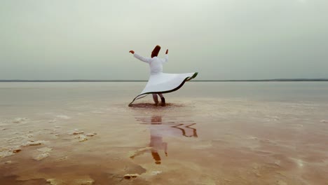 sunset and whirling at the sea, sufi. sufi whirling (turkish: semazen)