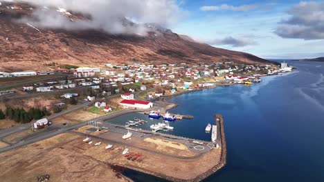 Aerial-View-Of-Harbor-In-Faskrudsfjordur-In-East-Iceland---drone-shot