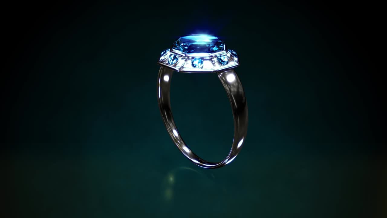 Anello lucido in oro bianco o argento con gemme di topazio blu che ruota, fittizio - video in loop