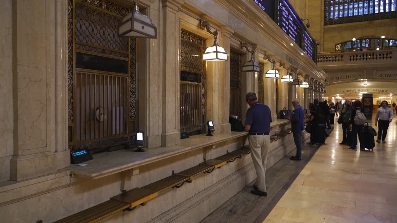 People Waiting in Line at Grand Central Terminal Ticket Counters