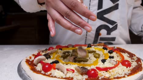 putting mushroom on pizza  closeup