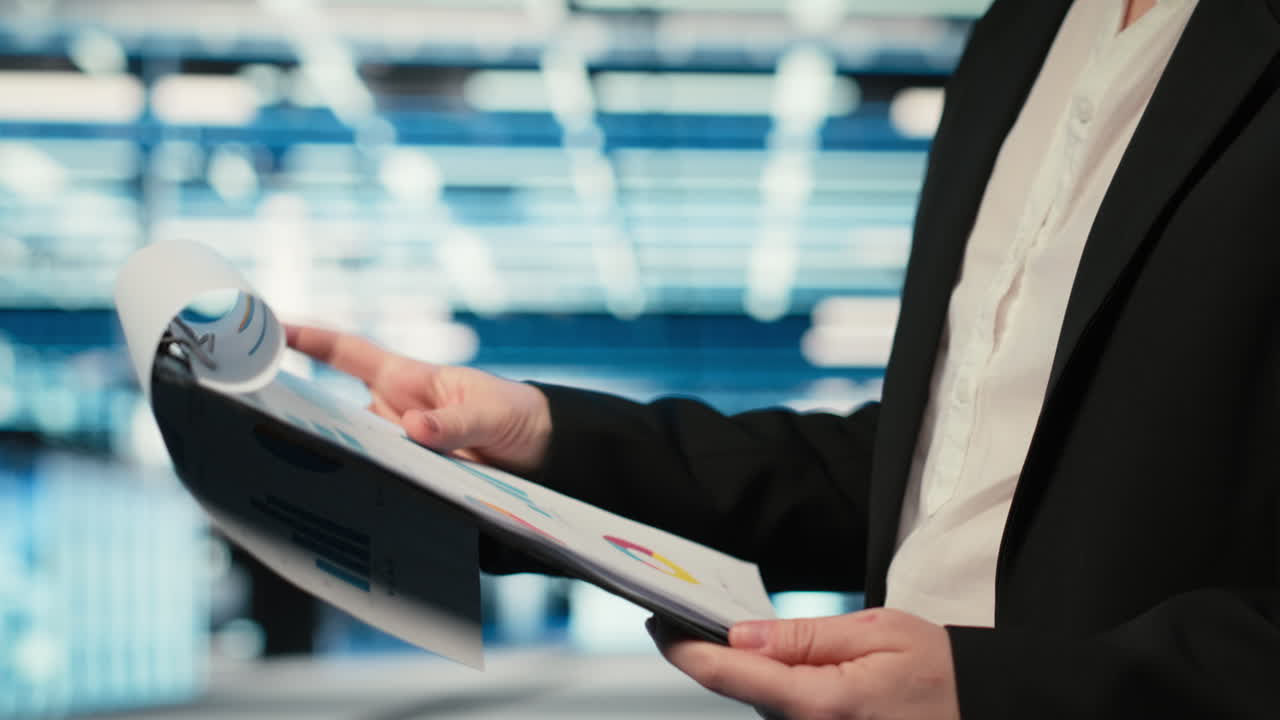 Close Up Of Data Center Engineer Reading Clipboard Files Charts