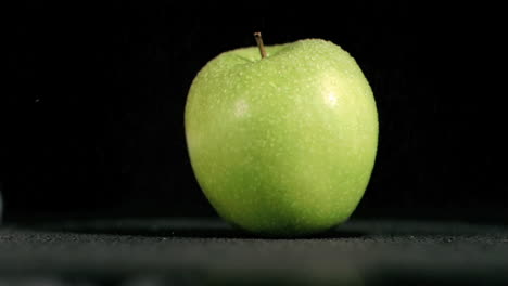 wet apple in super slow motion