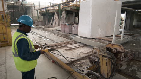 man transporting marble piece