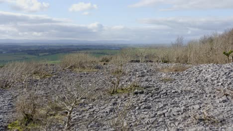 Ascending-Landscape-Aerial-looking-over-fields-past-knights-tower