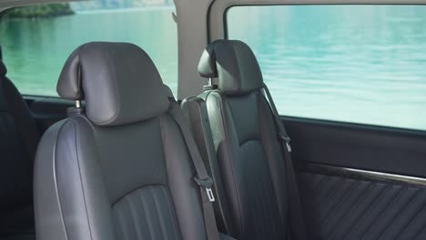 leather seats interior of luxury minivan by lake wakatipu, queenstown, new zealand