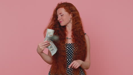 Redhead-girl-holding-cash-money-dollar-celebrate-dance,-success-business-career,-lottery-game-winner