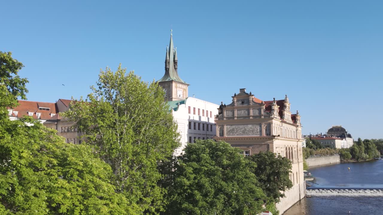 View of Prague’s Old Town Bridge Tower and Bedrich Smetana Museum on a clear sunny day