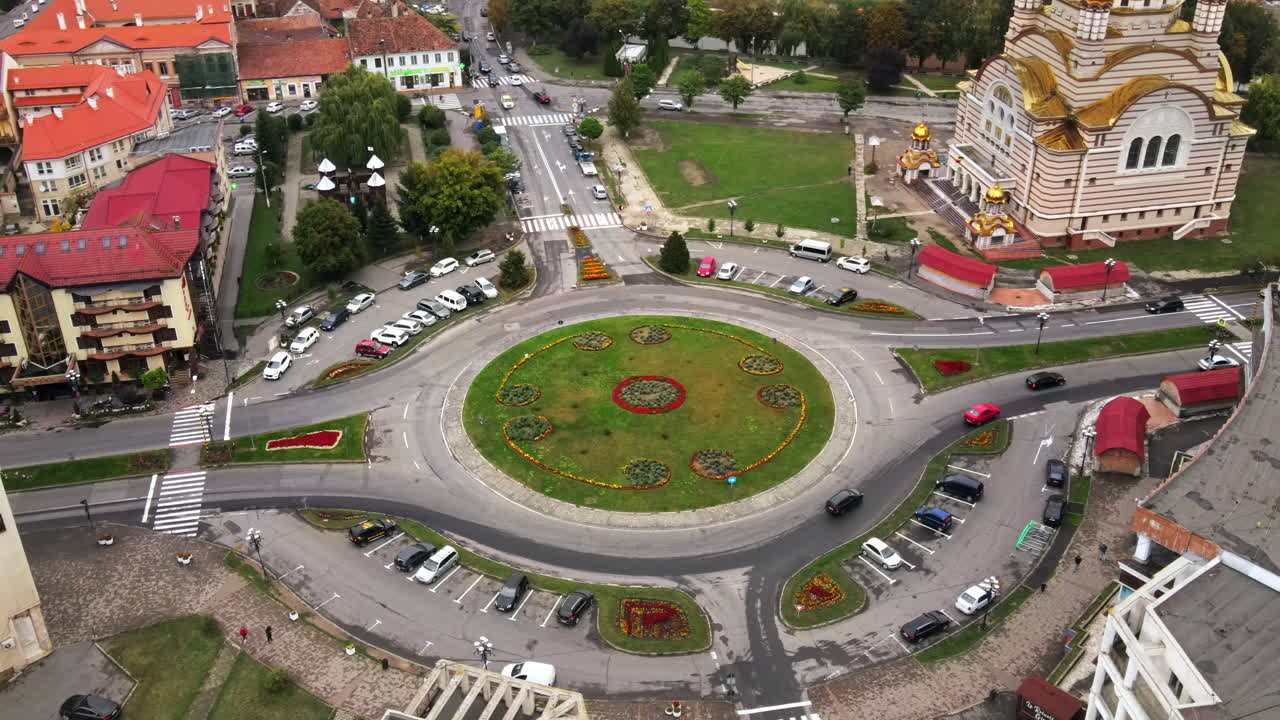 Aerial drone view of the Fagaras, Romania. Church of the Saint John the Baptist, multiple buildings, roads