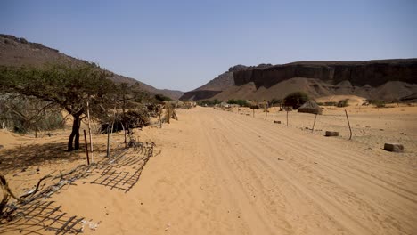 dirt road in sahara desert village in terjit oasis, mauritani, africa