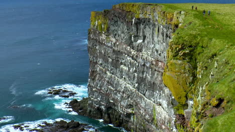 beautiful, green cliffs in latrabjarg promontory over atlantic ocean in the westfjords of iceland - the westernmost point in iceland