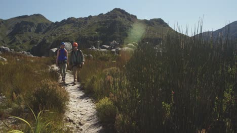 young caucasian couple walking in zip lining equipment