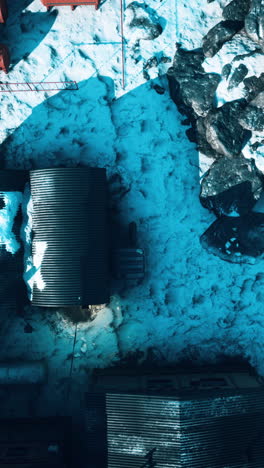 aerial view of a building covered in snow