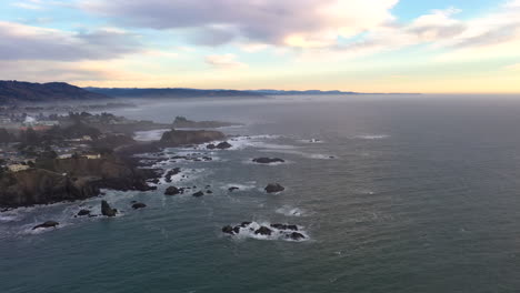 panoramic aerial view of brookings, oregon coastline at sunset