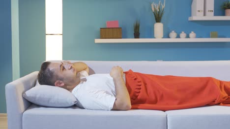 the man with his head on the pillow.