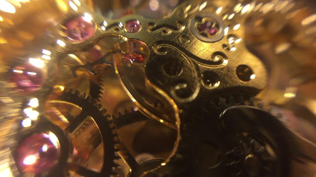 Mechanical watch movement with exposed gears on top of old fashioned pocket watch, defocused