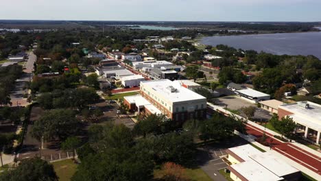 drone orbits left to right around historic main street in downtown clermont florida