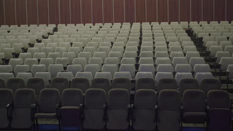 empty assembly hall with no people with vintage chairs without people requiring renovation and reconstruction