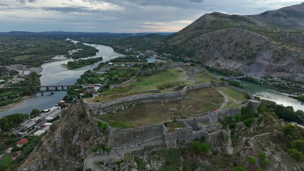 Ancient stone walls of Rozafa Castle on mountain in Scodra in Albania, aerial