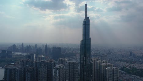 landmark and surrounding high rise buildings, saigon river and city skyline