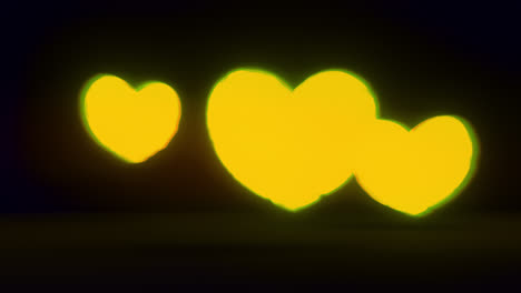 yellow energy heart shapes on a dark background