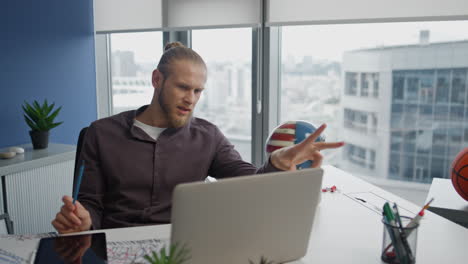 Critical-freelancer-explaining-laptop-home-closeup.-Sceptic-man-speaking-video