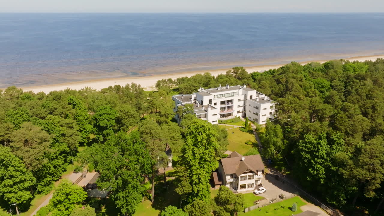 Aerial view of a seaview apartment building at a beach, summer day in Latvia