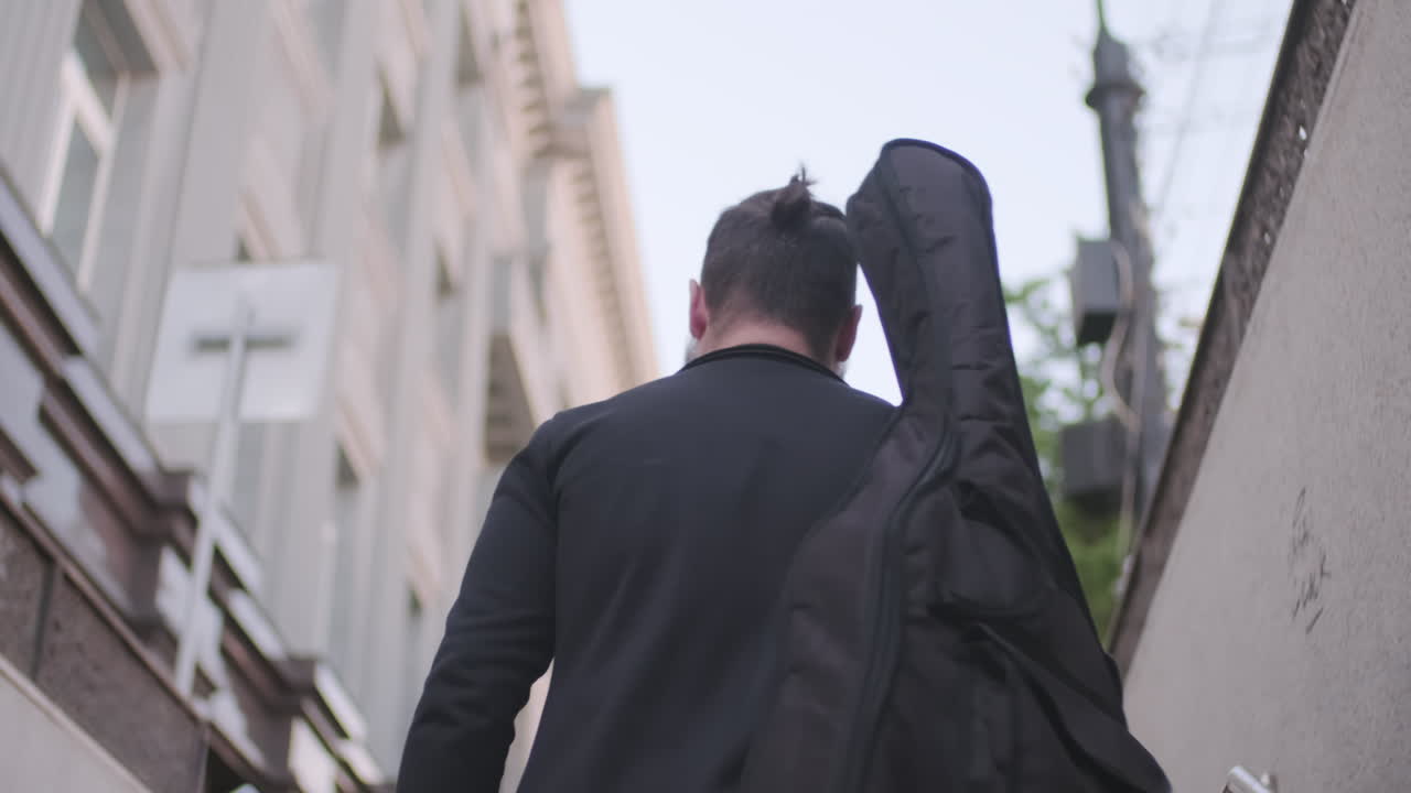Musician Walking Out of Subway Station