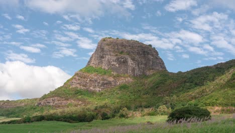 early morning time-lapse of large mountain pillar on mauritius island