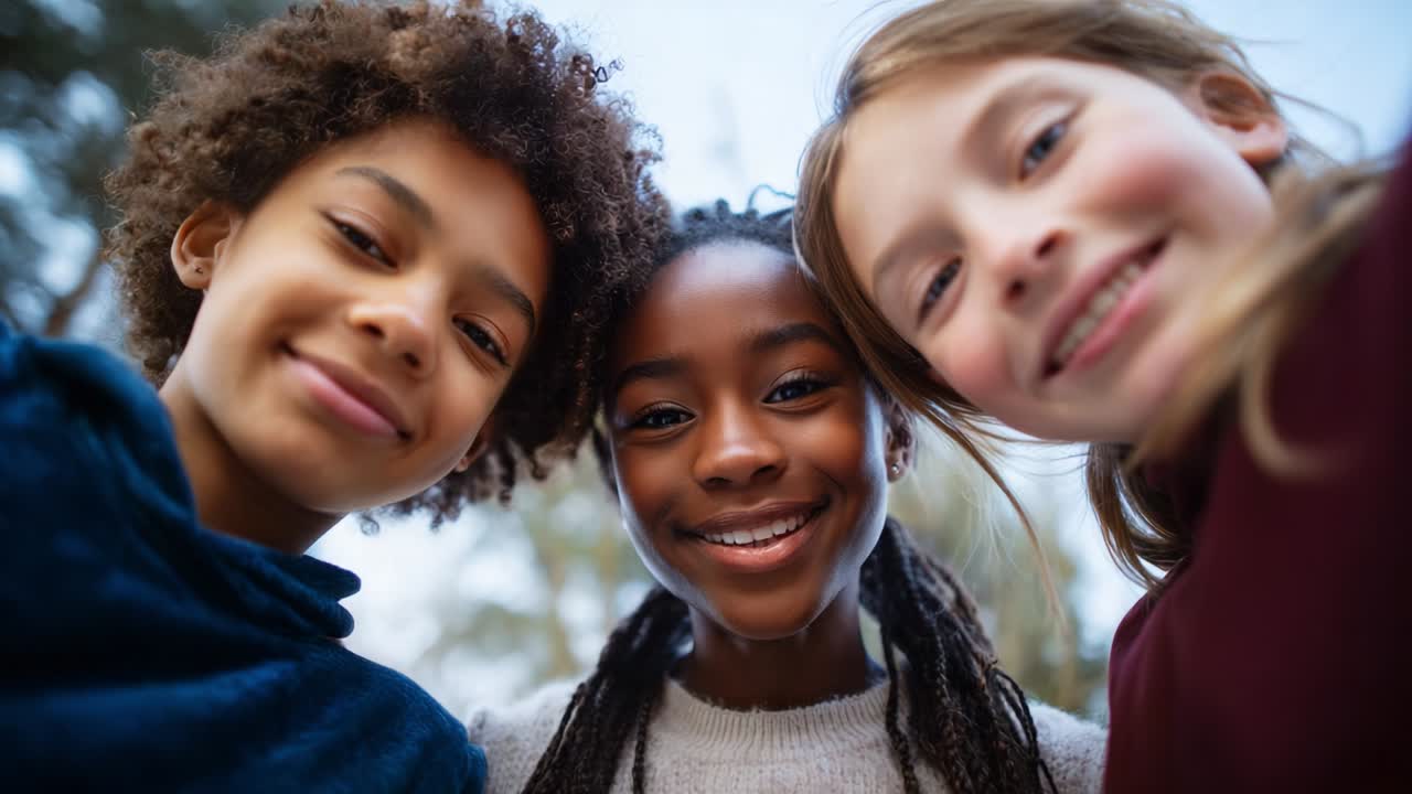 Three joyful friends come together to share a moment of happiness, smiling warmly at the camera while showcasing their friendship in a vibrant outdoor setting filled with natural beauty