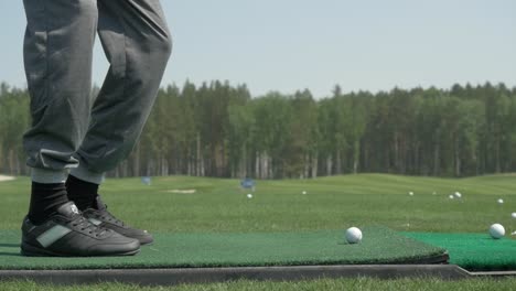 golfer preparing to hit a golf ball