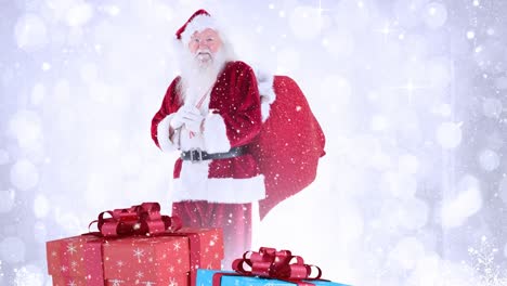 santa claus con regalos de navidad combinados con la caída de nieve