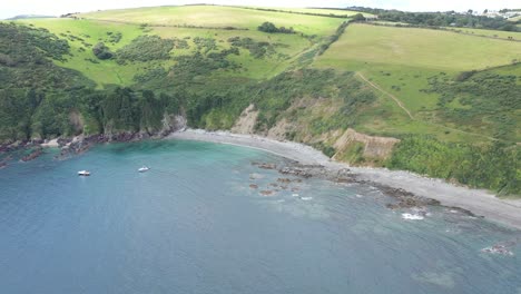 Wide-aerial-view-of-a-remote-bay-on-the-South-West-Coastal-Path,-Cornwall,-UK