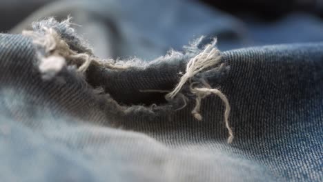 close up of ripped denim jeans