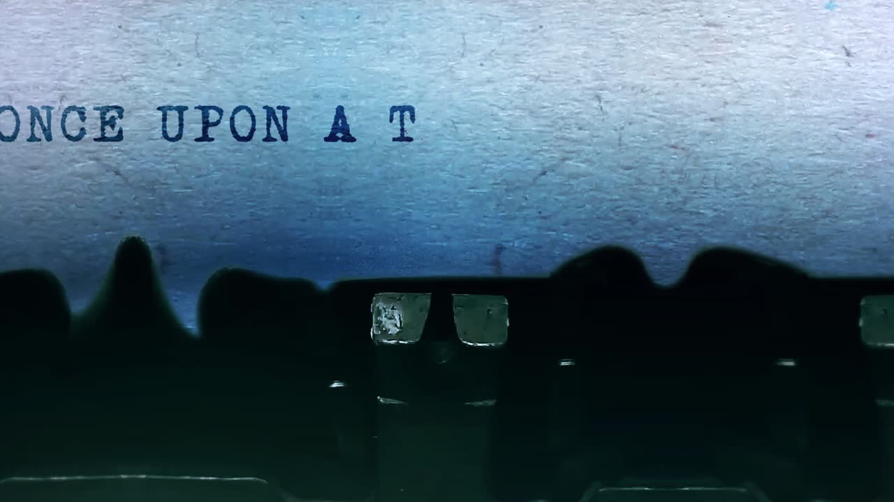 Once upon a time word closeup being typing and centered on a sheet of paper on old vintage