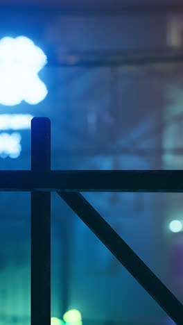 vibrant neon lights illuminate urban street at night in lively atmosphere