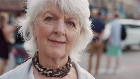 slow motion portrait of happy mature old woman smiling