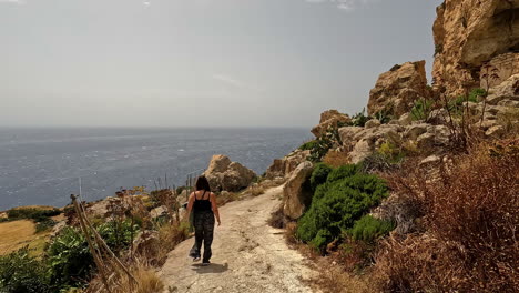 a lady is exploring, trekking, and walking alone toward the islands of latvia